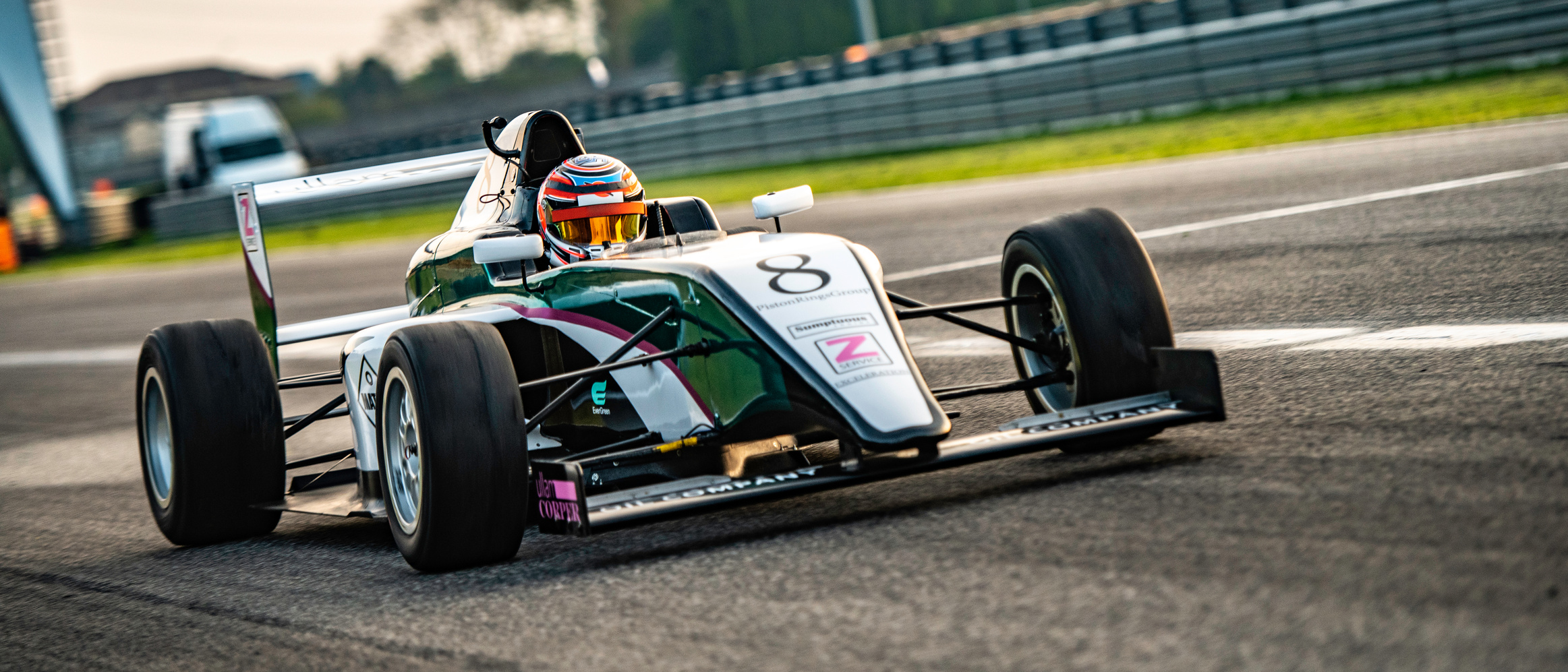 Man driving formula racing car